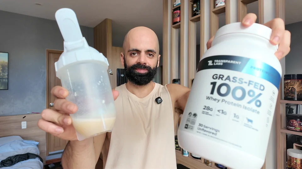 Nader holding Transparent Labs Unflavored whey protein and a mixed shaker