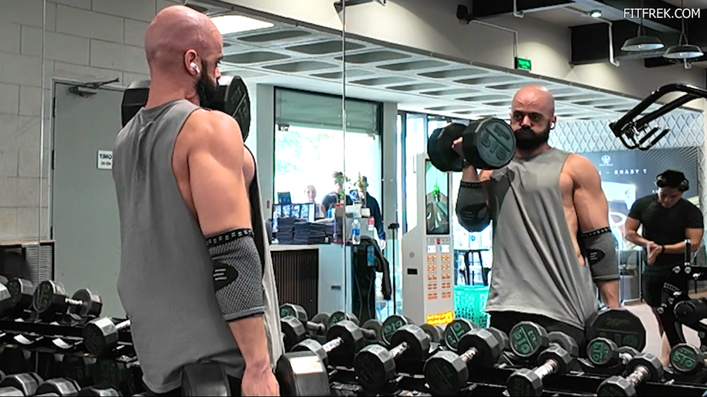 FitFrek reviewer training with dumbbells while testing Transparent Labs Hydrate Black